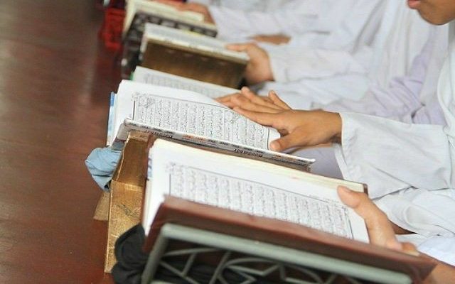 Muslim kids learning Quran in a Masjid